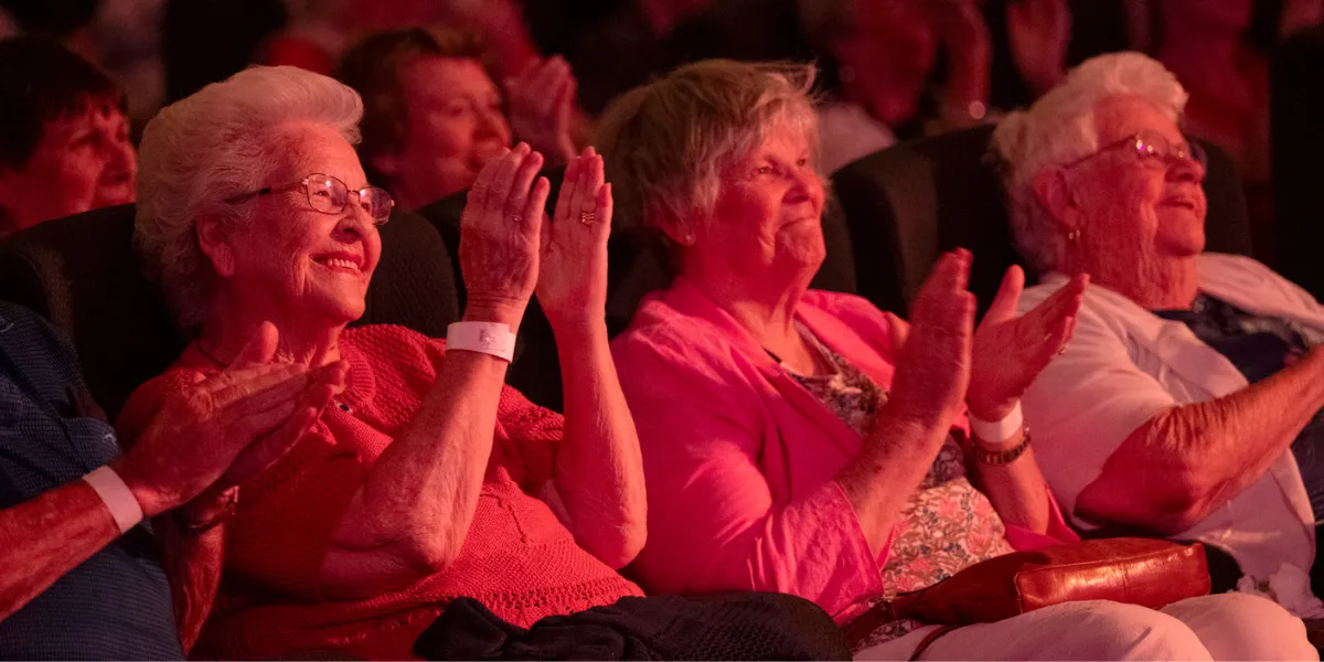 Female Residents Applauding Rhythm & Razzle Performance