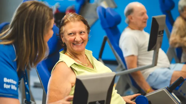 Female health and fitness client on machine 