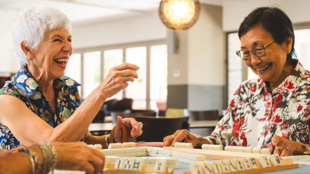 Pearl Retirement Resort Residents Playing A Board Game