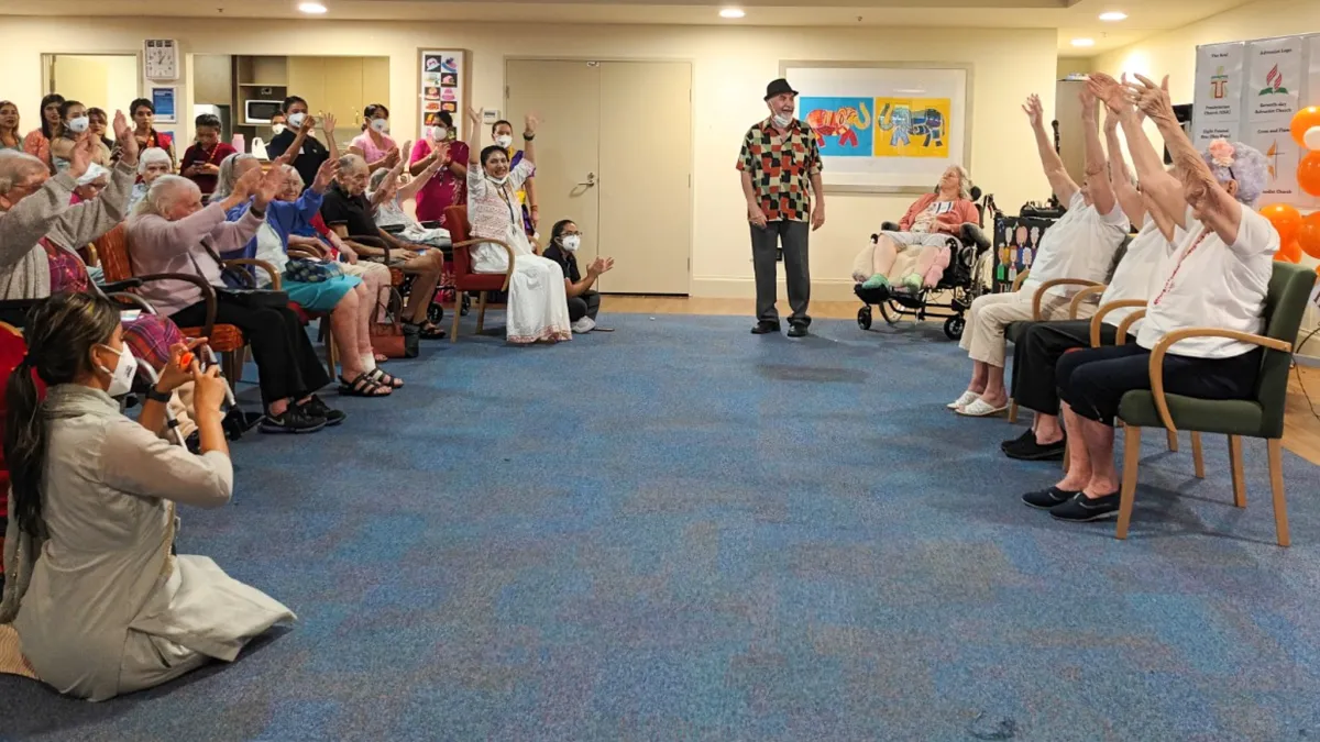 Aged care residents do the Hokey Pokey