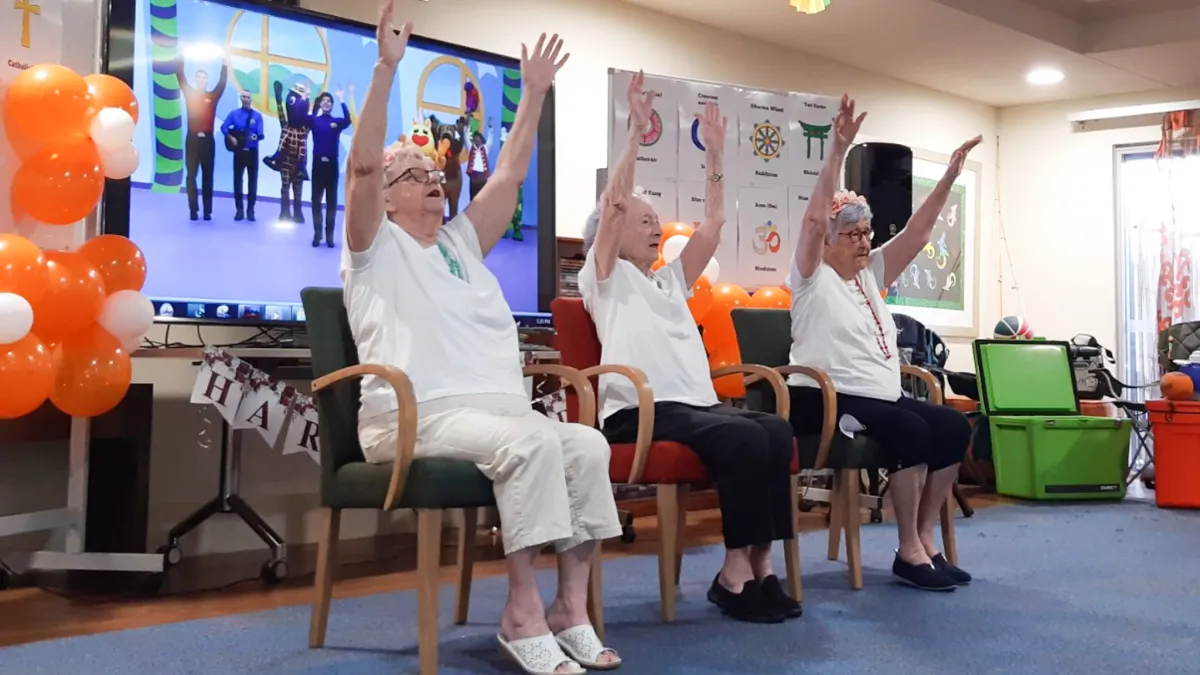 Aged care residents do the Hokey Pokey