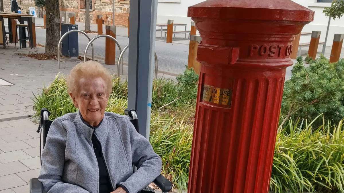 Doreen Read with an old Post Office box