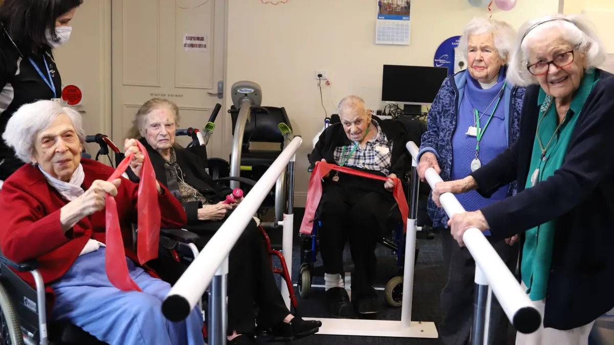 The 100 club at The Lodge Lourdes Valley exercise together in the gym