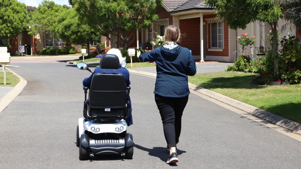 Occupational Therapist Tori Hunter leads a client in an electric mobility aid assessment