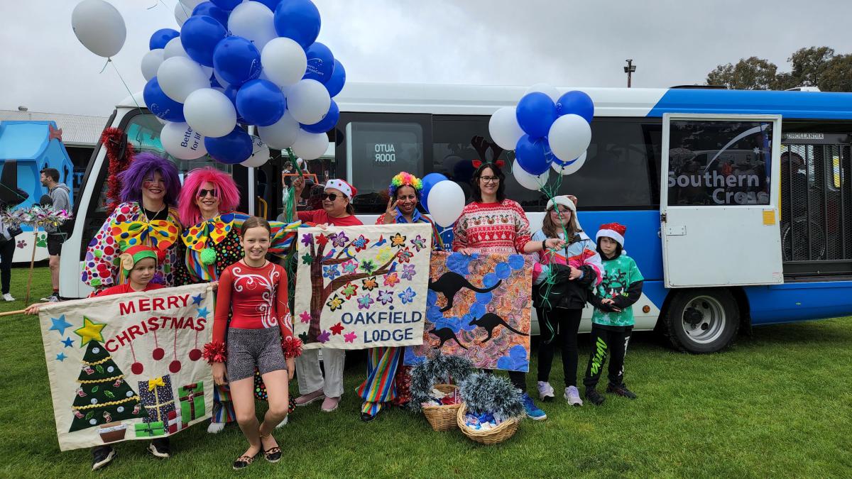 Staff and families with the Southern Cross Care bus