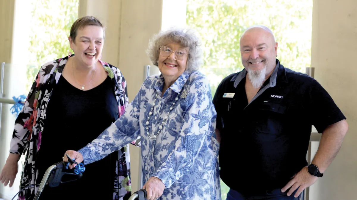 Esme and Staff Members On Balcony At Bucklands Residential Care