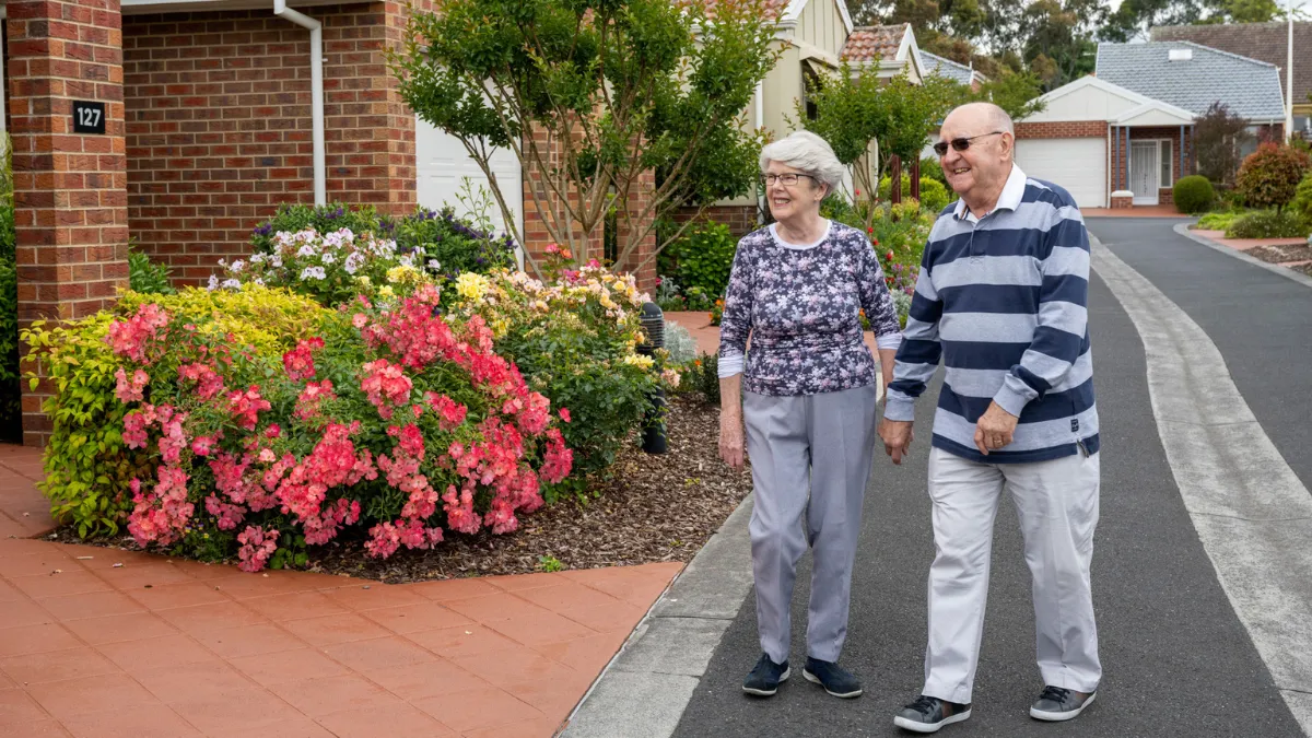 Male and Female Resident Walking Together Outside