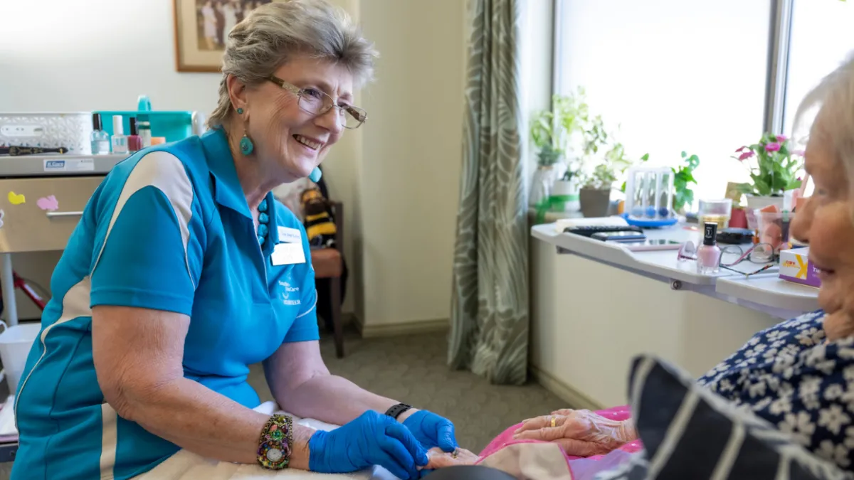 Volunteer Lyn painting nails