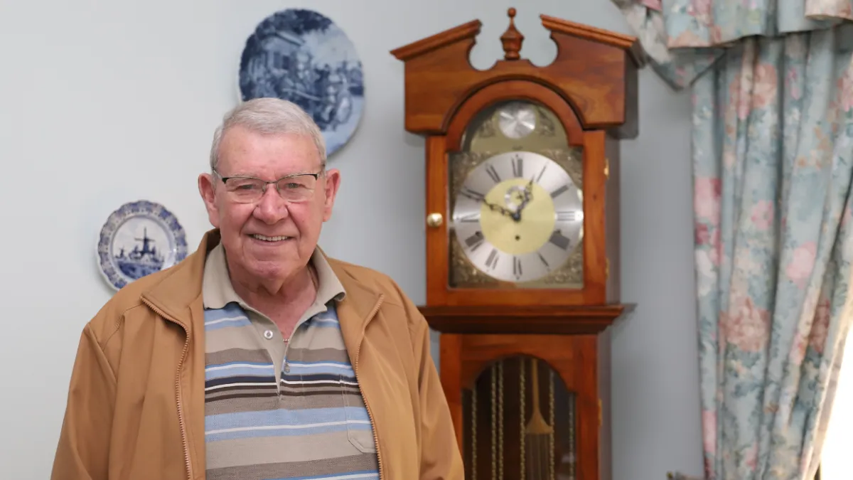 Tony Manders with a grandfather clock he made