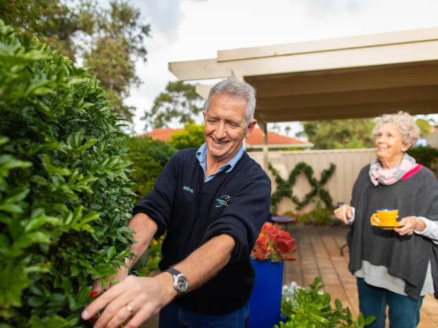 Home Care gardener doing pruning