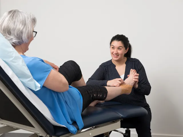 Lady Having Foot Strapped By Southern Cross Care Podiatrist 