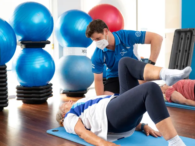 HW The Pines instructor with lady in exercise class