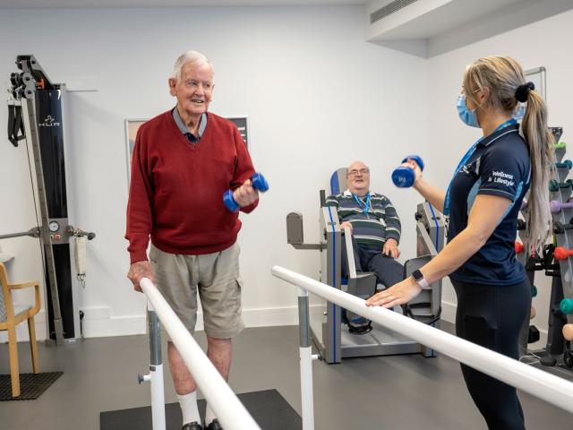 Carmelite Residential Care man in gym with instructor