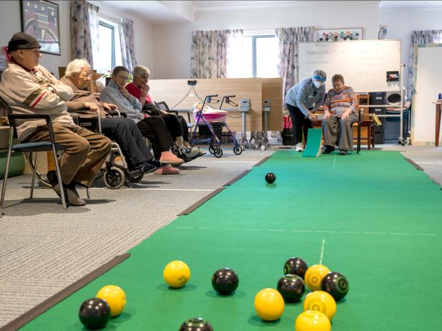 McCracken Residential Care Residents Playing Carpet Bowls
