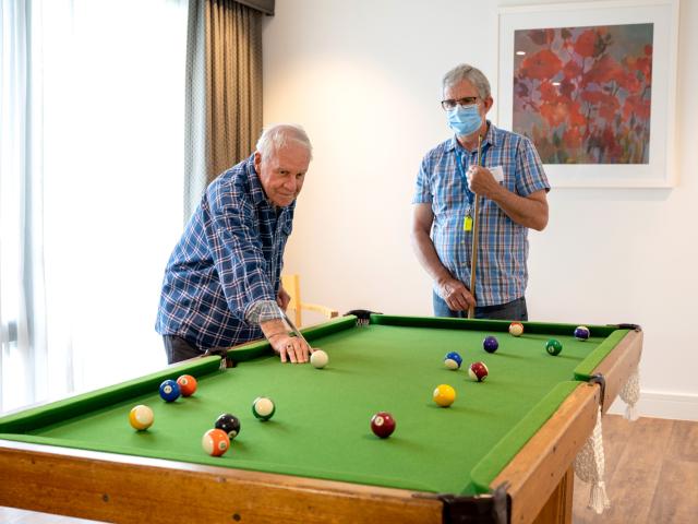 Oakfield Lodge Residential Care residents playing pool