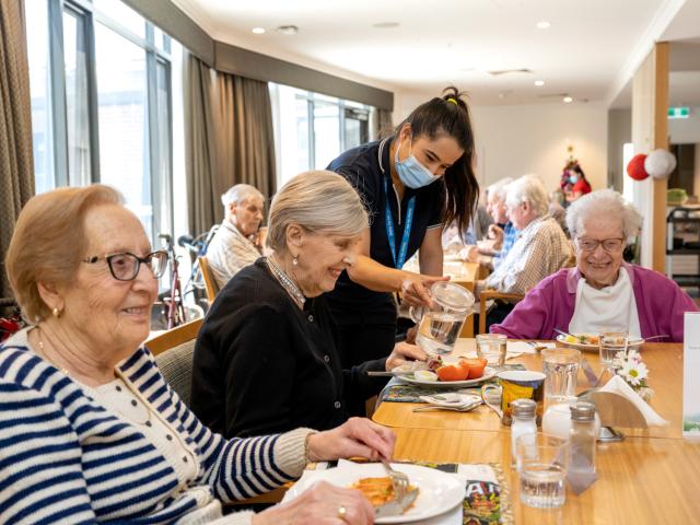 Oakfield Lodge Residential Care residents in dining room having lunch