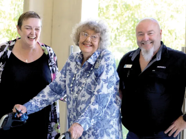 Esme and Staff Members On Balcony At Bucklands Residential Care