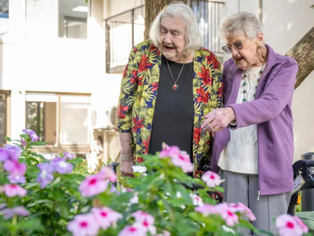 Two Female Residents In Garden At Fullarton Residential Care