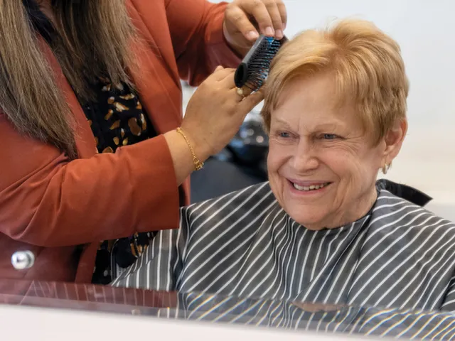 Female Resident Getting Haircut in on-site salon