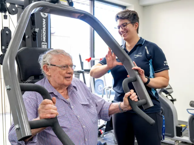 Male Resident On Exercise Machine At Mount Carmel Residential Care