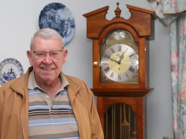 Tony Manders with a grandfather clock he made