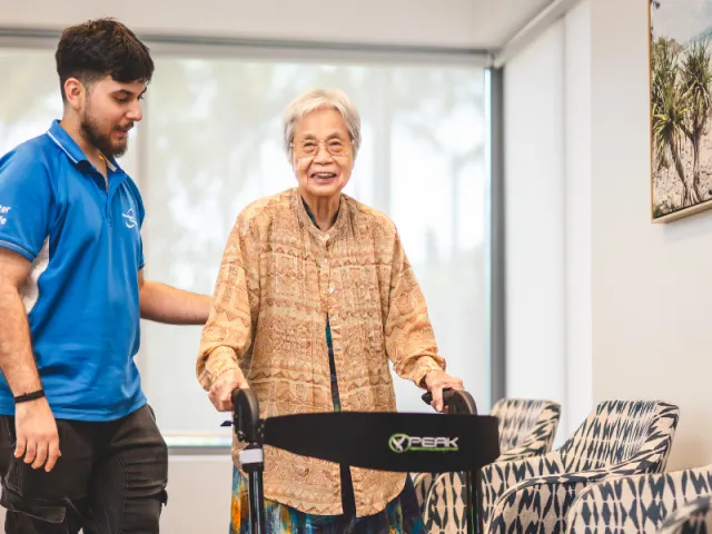 Pearl Supported Care Female Resident and Male Southern Cross Care Health & Fitness Staff Member.