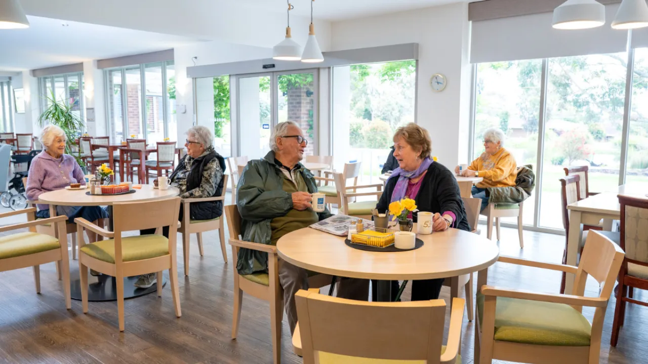Residents In Cafe At The Mornington Retirement Village 