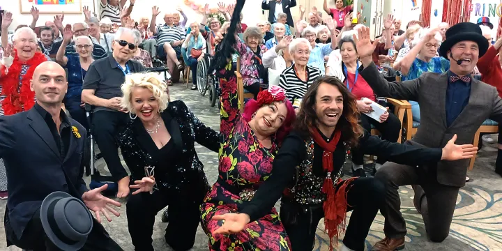 Group Photo Of Rhythm & Motion Performers With The Audience