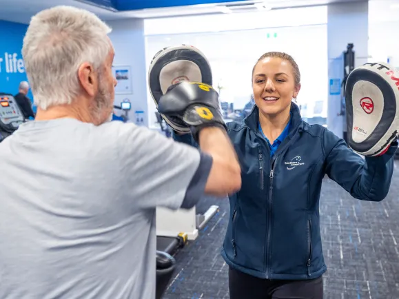 A client with Parkinson’s engaging in a boxing drill with Exercise Physiologist 