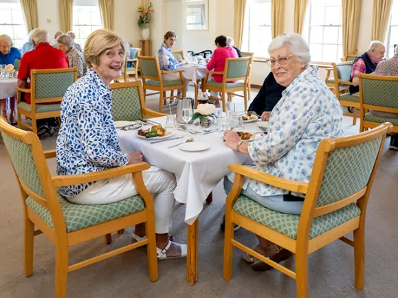 Residents Sitting At Table and Sharing A Meal At Glen Woodley Serviced Apartments 640x480