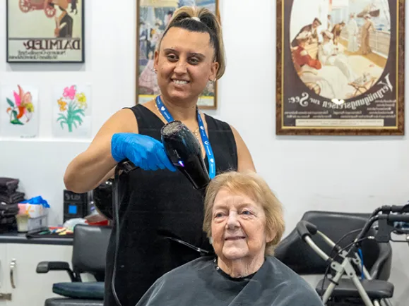 Female Resident At Hairdresser At The Phillip Kennedy Centre Residential Care
