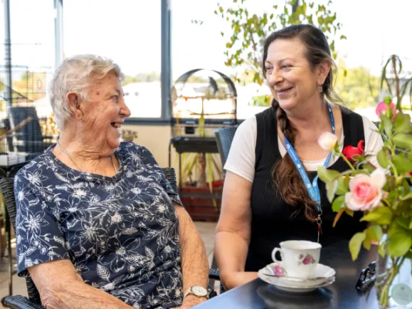 Female Resident and Staff Member At The West Beach Residential Care
