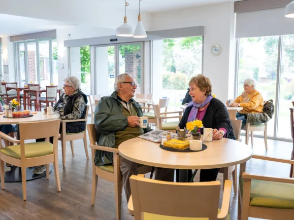 Residents In Cafe At The Mornington Retirement Village 