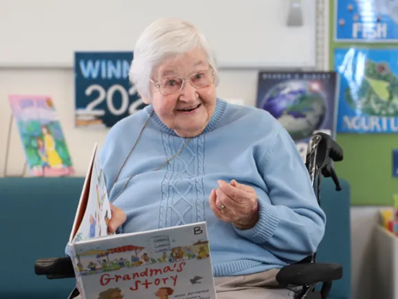 Female Resident Reading Book