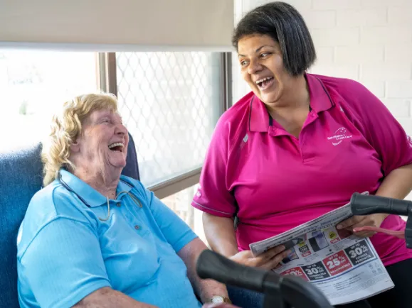 Female Resident and Female Staff Member Having A Chat Together At The Phillip Kennedy Centre Residential Care