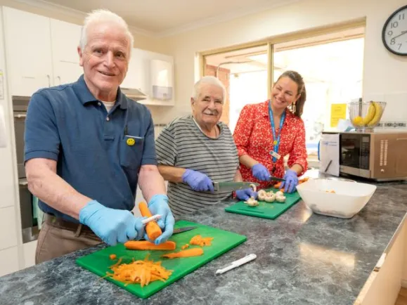 Willow Fern Residents cooking with support worker 