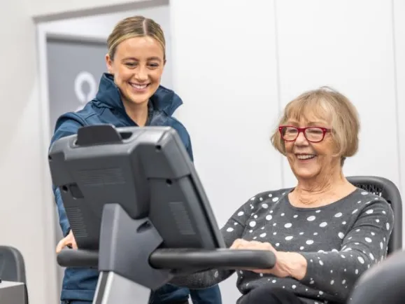 Health & Fitness client working with fitness instructor 