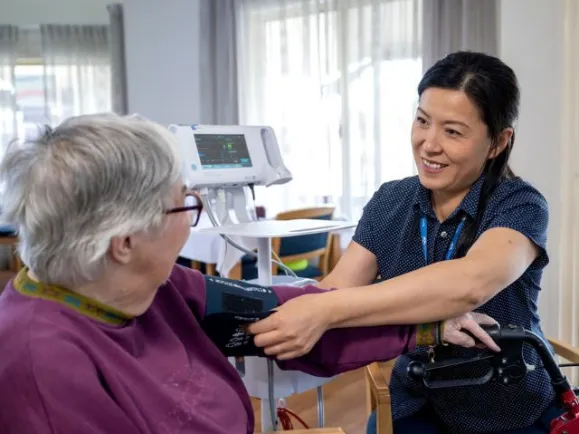 Registered Nurse with JP II resident 