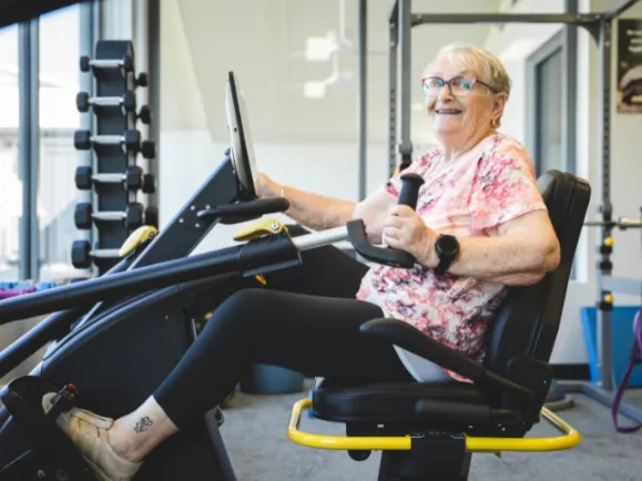 Pearl Health and Fitness female client on machine 