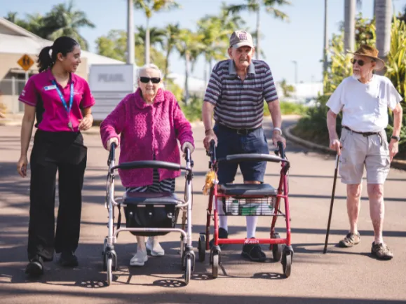 Pearl Supported Care Residents Walking Outside With Lifestyle Coordinator