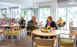 Residents In Cafe At The Mornington Retirement Village 